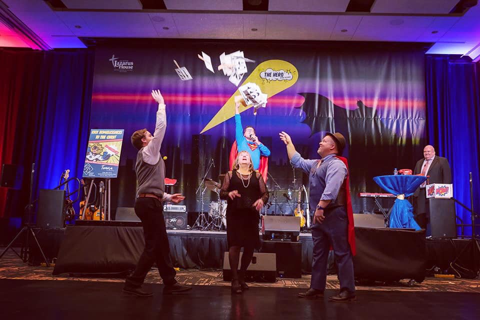 Raising Paddles at a fundraising event