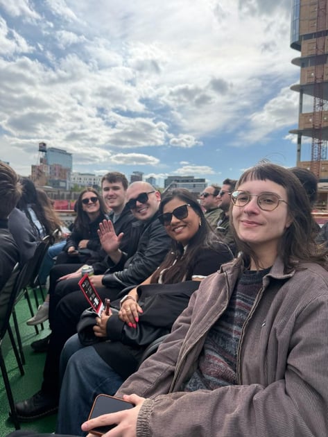 Teammates laughing on the Chicago architecture river tour