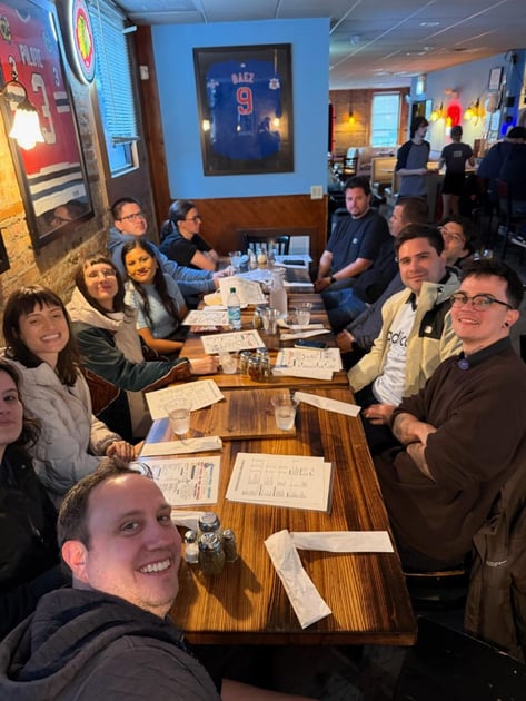 The team around the table at a group dinner